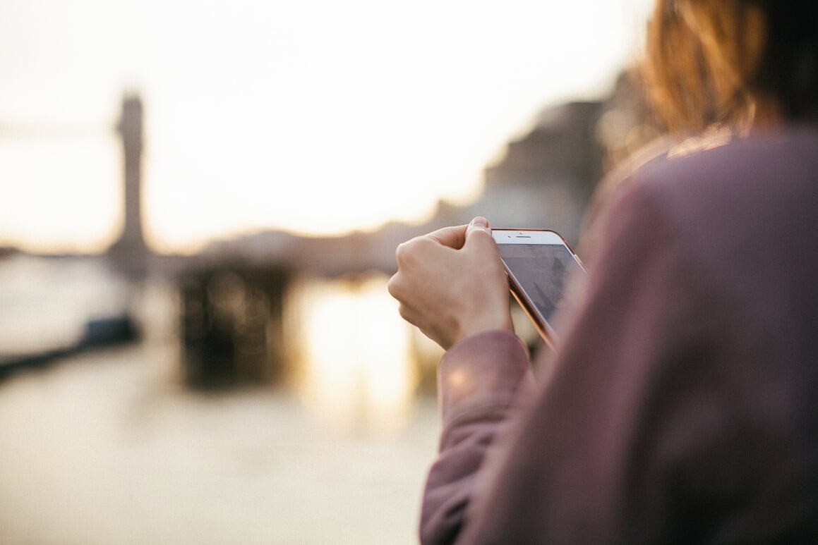 Person Holding White Phone