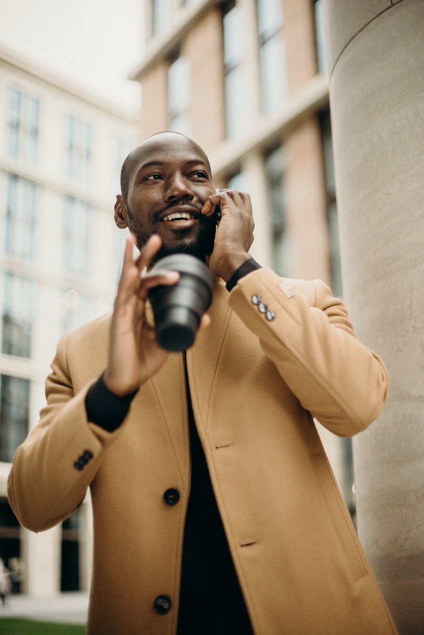 Man Holding Black Cup